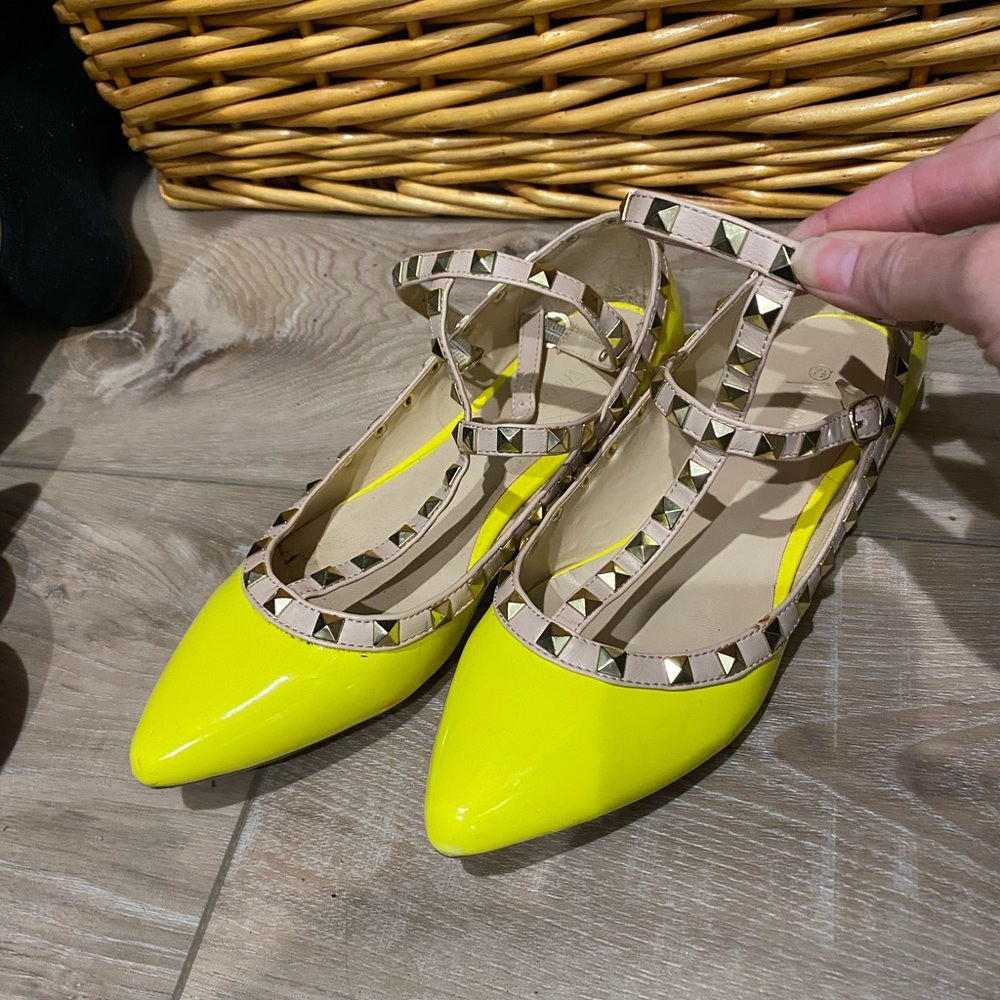 Bright yellow studded flats